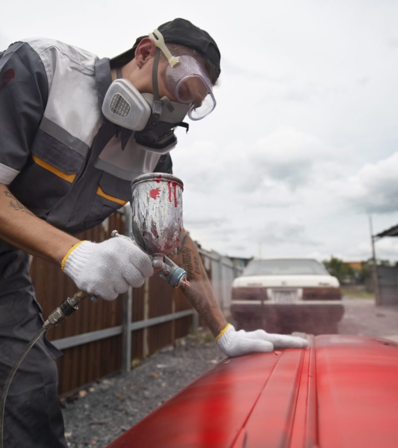 medium-shot-man-painting-car-door